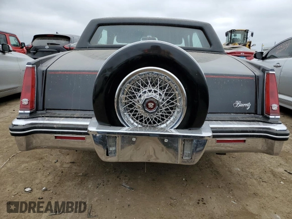 1985 Cadillac Eldorado z VIN 1G6EL5782FE634074, wystawiony jako Copart lot #44520964 z przebiegiem 74 425 mil mil oraz Szkody całkowita. Historia ofert i sprzedaży dostępna na DreamBid. Obrazek 6.