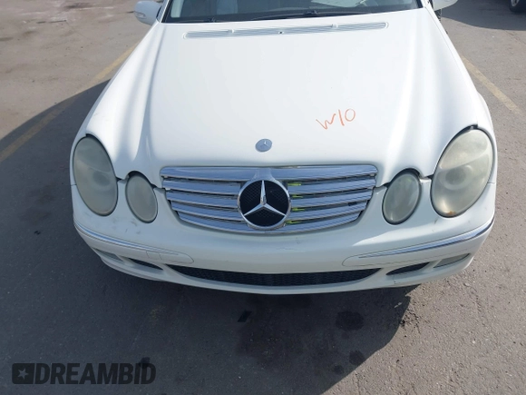 2003 Mercedes-Benz E-Class 3.2L with VIN WDBUF65J63A233107, listed as a IAAI auction lot 42004763 with 151,327 mi miles. Bid and sale history available at carsss.com. Image 6.