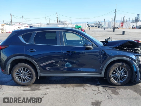 2019 Mazda CX-5 Touring with VIN JM3KFACM7K1534905, listed as a IAAI auction lot 41945607 with 56,014 mi miles. Bid and sale history available at carsss.com. Image 14.