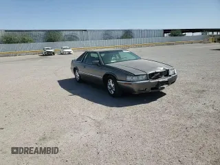 1998 Cadillac Eldorado z VIN 1G6EL12YXWU610918, wystawiony jako Copart lot #57309075 z przebiegiem 168 228 mil mil oraz Szkoda całkowita • Salvage title. Historia ofert i sprzedaży dostępna na DreamBid. Obrazek 13.