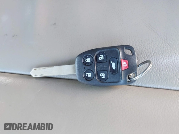 2012 Honda Odyssey Touring with VIN 5FNRL5H9XCB067841, listed as a IAAI auction lot 40631672 with 210,237 mi miles and . Bid and sale history available at DreamBid. Image 11.