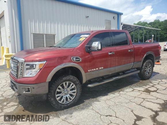 2017 Nissan Titan Pro-4X z VIN 1N6BA1F43HN562363, wystawiony jako Copart lot #58604115 z przebiegiem 102 412 mil mil oraz Czysty tytuł • Clean title. Historia ofert i sprzedaży dostępna na DreamBid. Obrazek 1.