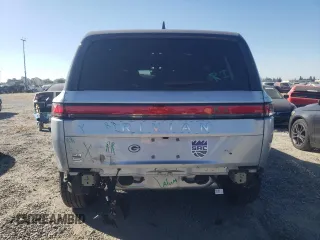 2024 Rivian R1S Adventure z VIN 7PDSGBBA5RN044560, wystawiony jako Copart lot #70594924 z przebiegiem 2449 mil mil oraz Szkody całkowita. Historia ofert i sprzedaży dostępna na DreamBid. Obrazek 6.