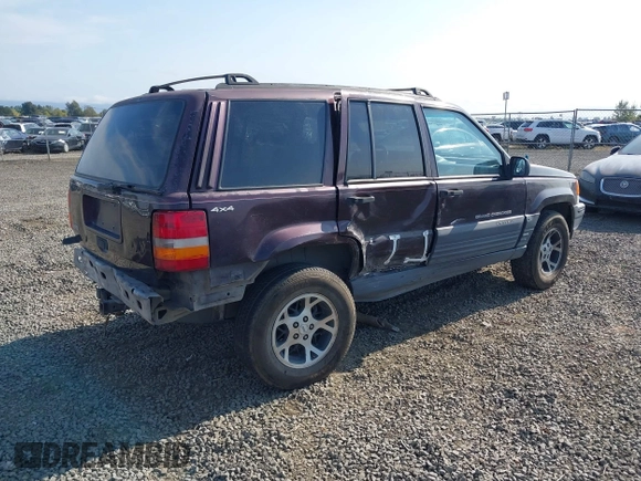 1996 Jeep Grand Cherokee Laredo with VIN 1J4GZ58S2TC262980, listed as a IAAI auction lot 41949514 with 269,674 mi miles and . Bid and sale history available at DreamBid. Image 4.