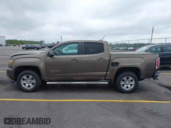 2015 GMC Canyon 2WD SLE with VIN 1GTG5BE38F1229799, listed as a IAAI auction lot 41944801 with 71,165 mi miles. Bid and sale history available at carsss.com. Image 14.
