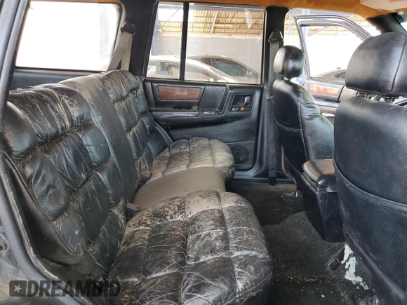 1994 Jeep Grand Cherokee Limited with VIN 1J4GZ78S5RC304501, listed as a Copart auction lot 64632335 with 184,333 mi miles and Salvage title. Bid and sale history available at DreamBid. Image 11.