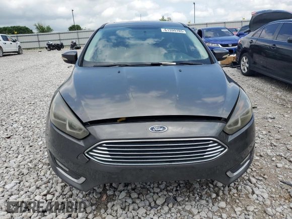 2017 Ford Focus Titanium z VIN 1FADP3N22HL307260, wystawiony jako Copart lot #61399785 z przebiegiem 103 293 mil mil oraz Szkoda całkowita • Salvage title. Historia ofert i sprzedaży dostępna na DreamBid. Obrazek 5.