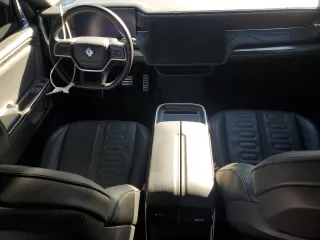 2022 Rivian R1T Launch Edition z VIN 7FCTGAAL7NN000539, wystawiony jako Copart lot #87811245 z przebiegiem Nie podano mil oraz Szkody całkowita. Historia ofert i sprzedaży dostępna na DreamBid. Obrazek 8.