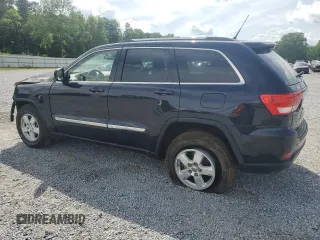 2011 Jeep Grand Cherokee Laredo with VIN 1J4RR4GG7BC515001, listed as a Copart auction lot 56432905 with 143,181 mi miles and Salvage title. Bid and sale history available at DreamBid. Image 2.