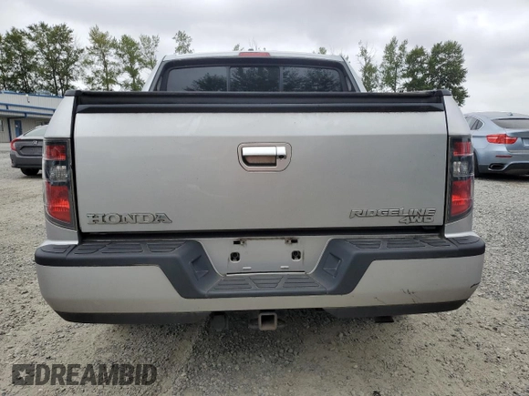 2014 Honda Ridgeline Sport with VIN 5FPYK1F7XEB011983, listed as a Copart auction lot 64146835 with 121,345 mi miles and Salvage title. Bid and sale history available at DreamBid. Image 6.