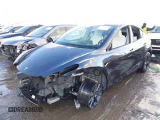 2024 Tesla Model Y Long Range with VIN 7SAYGDEE0RA300064, listed as a IAAI auction lot 41640541 with 5,049 mi miles and . Bid and sale history available at DreamBid. Image 6.