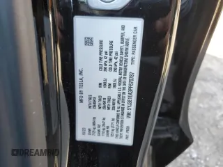 2023 Tesla Model 3 with VIN 5YJ3E1EA3PF670787, listed as a Copart auction lot 49070865 with 13,489 mi miles and Salvage title. Bid and sale history available at DreamBid. Image 12.
