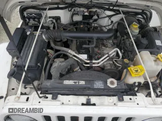 2002 Jeep Wrangler Sahara with VIN 1J4FA59S02P727359, listed as a Copart auction lot 74823414 with 84,186 mi miles and Salvage Title. Bid and sale history available at carsss.com. Image 11.