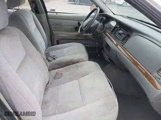 2003 Ford Crown Victoria LX with VIN 2FAFP74WX3X154904, listed as a IAAI auction lot 42094274 with 123,579 mi miles. Bid and sale history available at carsss.com. Image 5.
