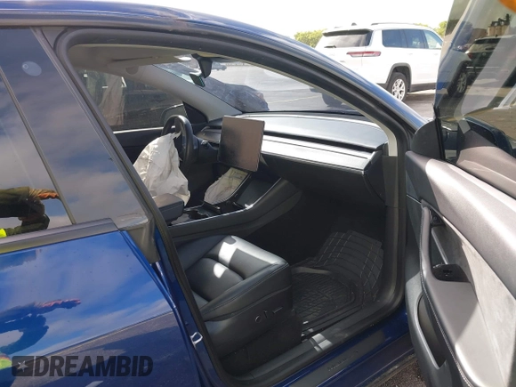 2021 Tesla Model Y Standard Range with VIN 5YJYGDED4MF112857, listed as a IAAI auction lot 41134600 with Not Provided miles and . Bid and sale history available at DreamBid. Image 5.
