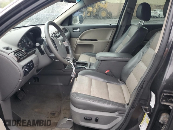 2008 Mercury Sable Premier z VIN 1MEHM43W98G604677, wystawiony jako Copart lot #57840985 z przebiegiem 171 695 mil mil oraz Szkoda całkowita • Salvage title. Historia ofert i sprzedaży dostępna na DreamBid. Obrazek 7.