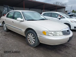 1999 Lincoln Continental with VIN 1LNHM97V1XY691852, listed as a IAAI auction lot 41820994 with 98,858 mi miles. Bid and sale history available at carsss.com. Image 1.