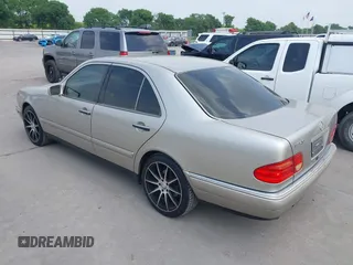 1999 Mercedes-Benz E-Class with VIN WDBJF65H9XA799820, listed as a IAAI auction lot 41959156 with 150,133 mi miles. Bid and sale history available at carsss.com. Image 3.