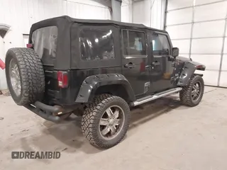 2008 Jeep Wrangler Unlimited X with VIN 1J4GA391X8L558984, listed as a IAAI auction lot 41016498 with 123,308 mi miles. Bid and sale history available at carsss.com. Image 4.