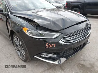 2017 Ford Fusion Titanium z VIN 3FA6P0K98HR200272, wystawiony jako IAAI lot #41905017 z przebiegiem 104 132 mil mil oraz . Historia ofert i sprzedaży dostępna na DreamBid. Obrazek 6.