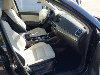 2016 Mazda CX-5 Grand Touring with VIN JM3KE4DY4G0677605, listed as a IAAI auction lot 41642893 with Not Provided miles and . Bid and sale history available at carsss.com. Image 5.