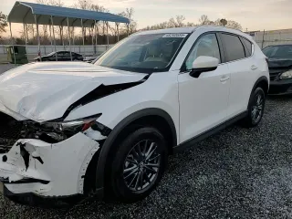 2020 Mazda CX-5 Touring with VIN JM3KFACM0L0863937, listed as a Copart auction lot 48240655 with 70,592 mi miles and Salvage Title. Bid and sale history available at carsss.com. Image 14.