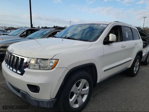2011 Jeep Grand Cherokee Laredo with VIN 1J4RR4GG1BC669834, listed as a IAAI auction lot 42019804 with 173,943 mi miles. Bid and sale history available at carsss.com. Image 2.