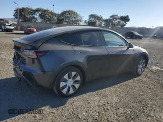2024 Tesla Model Y with VIN 7SAYGDED4RF017614, listed as a Copart auction lot 88494625 with 11,209 mi miles and Salvage title. Bid and sale history available at DreamBid. Image 3.