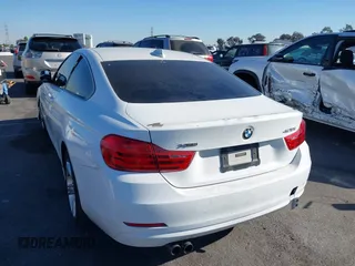 2014 BMW 4 Series 428i xDrive with VIN WBA3N5C56EF716566, listed as a IAAI auction lot 41245322 with 72,252 mi miles and . Bid and sale history available at DreamBid. Image 3.