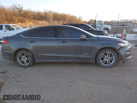 2015 Ford Fusion SE Hybrid with VIN 3FA6P0LU1FR219908, listed as a IAAI auction lot 41272688 with 310,452 mi miles. Bid and sale history available at carsss.com. Image 14.