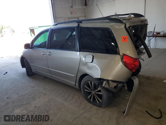 2010 Toyota Sienna XLE with VIN 5TDYK4CCXAS323450, listed as a Copart auction lot 62491545 with 220,121 mi miles and Salvage title. Bid and sale history available at DreamBid. Image 2.