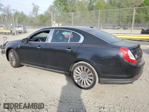 2014 Lincoln MKS with VIN 1LNHL9EK2EG610291, listed as a Copart auction lot 54544745 with 147,075 mi miles and Salvage Title. Bid and sale history available at carsss.com. Image 2.
