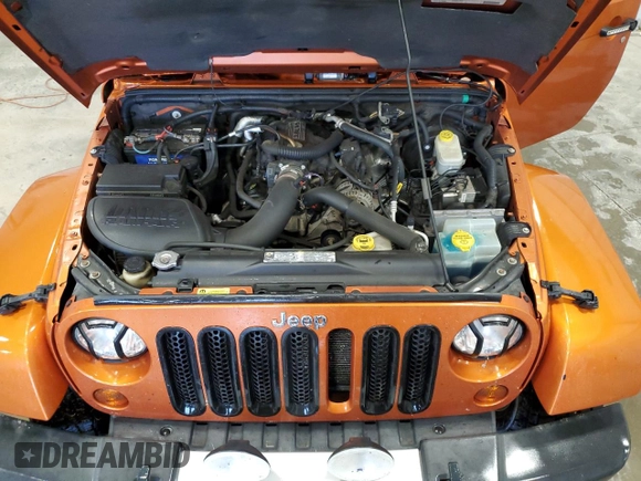 2011 Jeep Wrangler Sahara with VIN 1J4GA5D1XBL557392, listed as a Copart auction lot 56892835 with 109,567 mi miles and Clean title. Bid and sale history available at DreamBid. Image 12.