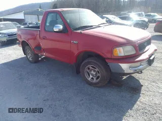 1997 Ford F-150 XL with VIN 1FTDF08W3VKB53525, listed as a IAAI auction lot 41787276 with 165,938 mi miles. Bid and sale history available at carsss.com. Image 1.