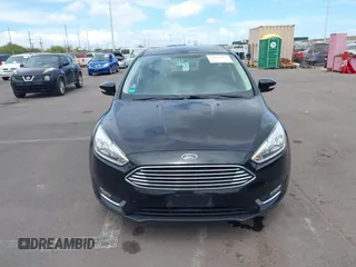 2017 Ford Focus Titanium z VIN 1FADP3N24HL326330, wystawiony jako IAAI lot #42594927 z przebiegiem 54 727 mil mil oraz . Historia ofert i sprzedaży dostępna na DreamBid. Obrazek 12.
