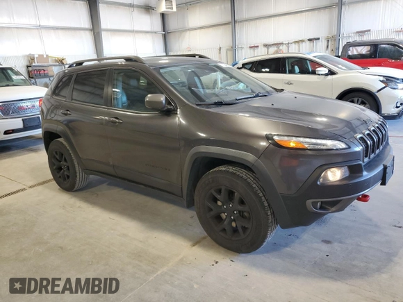 2015 Jeep Cherokee Trailhawk with VIN 1C4PJMBS5FW615845, listed as a Copart auction lot 52824635 with 134,873 mi miles and Salvage Title. Bid and sale history available at carsss.com. Image 4.
