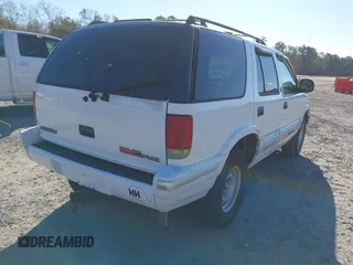 1997 GMC Jimmy SL with VIN 1GKCS13W9V2523837, listed as a IAAI auction lot 41359854 with 185,549 mi miles. Bid and sale history available at carsss.com. Image 4.