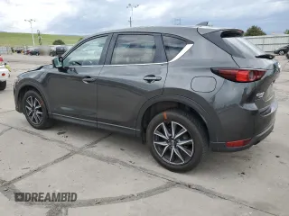 2018 Mazda CX-5 Touring z VIN JM3KFBCM4J0349687, wystawiony jako Copart lot #55857945 z przebiegiem Nie podano mil oraz Szkoda całkowita • Salvage title. Historia ofert i sprzedaży dostępna na DreamBid. Obrazek 2.