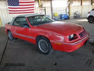 1990 Chrysler LeBaron z VIN 1C3XJ45J9LG405682, wystawiony jako Copart lot #48690985 z przebiegiem 75 714 mil mil oraz Tytuł czysty. Historia ofert i sprzedaży dostępna na DreamBid. Obrazek 4.