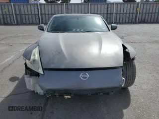 2014 Nissan 370Z z VIN JN1AZ4EH0EM630751, wystawiony jako Copart lot #51489825 z przebiegiem 125 107 mil mil oraz Czysty tytuł • Clean title. Historia ofert i sprzedaży dostępna na DreamBid. Obrazek 5.