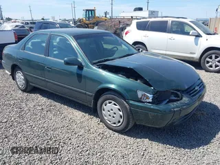 1999 Toyota Camry LE z VIN JT2BG28K8X0376440, wystawiony jako IAAI lot #42439941 z przebiegiem 163 936 mil mil oraz . Historia ofert i sprzedaży dostępna na DreamBid. Obrazek 1.