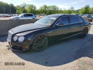 2015 Bentley Flying Spur z VIN SCBEC9ZAXFC049956, wystawiony jako Copart lot #58028015 z przebiegiem Nie podano mil oraz Szkody całkowita. Historia ofert i sprzedaży dostępna na DreamBid. Obrazek 1.