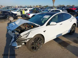 2018 Tesla Model 3 Long Range Battery with VIN 5YJ3E1EB0JF092440, listed as a IAAI auction lot 41881209 with 74,818 mi miles. Bid and sale history available at carsss.com. Image 2.