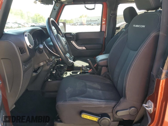 2014 Jeep Wrangler Rubicon with VIN 1C4BJWCG9EL285532, listed as a Copart auction lot 56548325 with 100,032 mi miles and Salvage title. Bid and sale history available at DreamBid. Image 7.