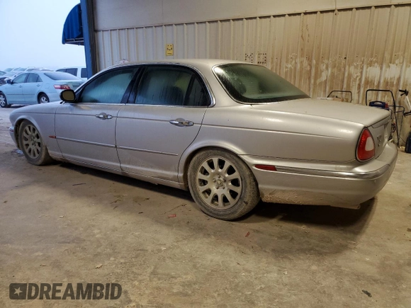 2004 Jaguar XJ with VIN SAJEA71C84SG07220, listed as a Copart auction lot 70916164 with 151,102 mi miles and Salvage Title. Bid and sale history available at carsss.com. Image 2.