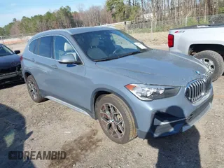 2021 BMW X1 xDrive28i with VIN WBXJG9C07M5T23053, listed as a IAAI auction lot 41774663 with 66,770 mi miles. Bid and sale history available at carsss.com. Image 1.
