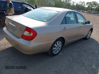 2002 Toyota Camry XLE z VIN 4T1BF30K02U001246, wystawiony jako IAAI lot #42334251 z przebiegiem 58 575 mil mil oraz . Historia ofert i sprzedaży dostępna na DreamBid. Obrazek 4.