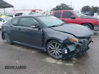2014 Scion tC with VIN JTKJF5C74E3075873, listed as a IAAI auction lot 41767004 with 149,971 mi miles. Bid and sale history available at carsss.com. Image 1.
