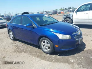 2013 Chevrolet Cruze 1LT with VIN 1G1PC5SB1D7248233, listed as a IAAI auction lot 42150409 with 151,307 mi miles and . Bid and sale history available at DreamBid. Image 1.