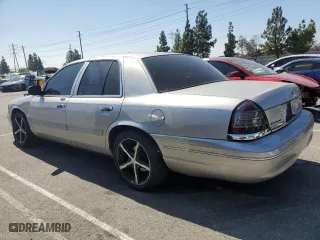 2004 Ford Crown Victoria LX with VIN 2FAFP74W44X184918, listed as a Copart auction lot 73346744 with 157,925 mi miles and Salvage Title. Bid and sale history available at carsss.com. Image 2.